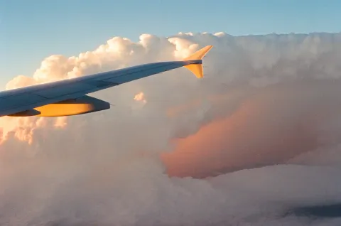 Airplane wing at sunset; general travel photography