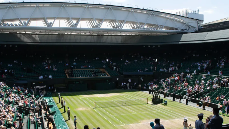 Spectators watching tennis on Wimbledons Centre Court